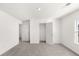 This bedroom features bright, neutral walls, carpeted floor, closet and a window for natural light at 1818 Lacebark Elm Way, Lawrenceville, GA 30045