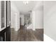 Bright foyer with hardwood floors and white walls, offering a welcoming entrance at 1818 Lacebark Elm Way, Lawrenceville, GA 30045