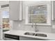 Bright kitchen with stainless steel sink, subway tile backsplash, and quartz countertops at 1818 Lacebark Elm Way, Lawrenceville, GA 30045
