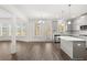 Open concept kitchen with island and stainless steel appliances at 1818 Lacebark Elm Way, Lawrenceville, GA 30045