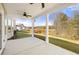Covered patio offers outdoor living with views of the landscaped backyard and natural surroundings at 1818 Lacebark Elm Way, Lawrenceville, GA 30045