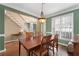 Formal dining room with chandelier and staircase at 2091 Suwanee Woods Ln, Duluth, GA 30097