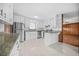 Well-lit kitchen with white cabinets, granite counters, and stainless steel appliances at 2649 Lake Harbin Road, Morrow, GA 30260