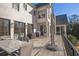 Outdoor patio area with a dining table, grill, and covered seating at 3224 Lanier Ne Dr, Atlanta, GA 30319