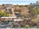 Aerial view of a complex with mature trees and a cityscape in the background at 323 3Rd Ne St # 5, Atlanta, GA 30308