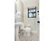 Classic bathroom features a pedestal sink and black-and-white tiled floor at 323 3Rd Ne St # 5, Atlanta, GA 30308