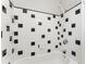 Bathtub with a black-and-white tiled wall at 323 3Rd Ne St # 5, Atlanta, GA 30308