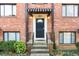 Close-up of the front entrance with striped awning, lighting, and black door at 323 3Rd Ne St # 5, Atlanta, GA 30308