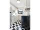Clean kitchen featuring black and white tiled floors, white cabinets, and stainless steel appliances at 323 3Rd Ne St # 5, Atlanta, GA 30308