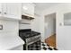 Bright kitchen area featuring checkerboard tile floor and modern appliances at 323 3Rd Ne St # 5, Atlanta, GA 30308