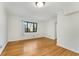 Bright living room boasts neutral walls, classic hardwood floors, and natural light at 323 3Rd Ne St # 5, Atlanta, GA 30308