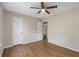 This is a bedroom with hardwood floors and a ceiling fan at 1010 James Madison Ct, Mcdonough, GA 30253