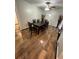 Traditional dining room with wood floors, a ceiling fan, and a large table with seating for six at 1625 Linda Dr, Decatur, GA 30032
