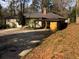 Charming single-story home with a well-maintained yard, mature trees, and a long, private driveway at 1625 Linda Dr, Decatur, GA 30032