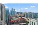 City skyline featuring modern architecture, red brick buildings, and blue sky at 1080 Peachtree Ne St # 2006, Atlanta, GA 30309