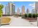 Community rooftop garden with lush greenery, walking path and seating with city views at 1080 Peachtree Ne St # 2006, Atlanta, GA 30309