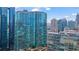 Exterior skyline view of the building, showcasing its modern architecture and glass facade at 1080 Peachtree Ne St # 2006, Atlanta, GA 30309