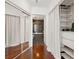 Hallway view with closet and bathroom entrance with updated finishes and hardwood flooring at 1080 Peachtree Ne St # 2006, Atlanta, GA 30309