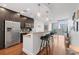 Bright kitchen featuring dark cabinets, stainless steel appliances, and granite countertops with bar seating at 1080 Peachtree Ne St # 2006, Atlanta, GA 30309