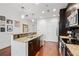 Bright, well-lit kitchen area boasts granite countertops, stainless steel appliances, and a breakfast bar at 1080 Peachtree Ne St # 2006, Atlanta, GA 30309