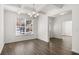 Dining room features hardwood floors, natural light, and an adjacent room at 1891 Lacebark Elm Way, Lawrenceville, GA 30045