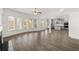 Bright living room next to kitchen, with hardwood flooring at 1891 Lacebark Elm Way, Lawrenceville, GA 30045