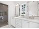 Bathroom features a double vanity with marble countertop, modern mirrors, and a glass enclosed shower at 3063 Peachtree Ne Dr, Atlanta, GA 30305