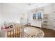 Bright Bedroom with hardwood floors, changing table, and playful alphabet rug at 3063 Peachtree Ne Dr, Atlanta, GA 30305