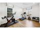 Well-lit home gym features modern workout equipment and large windows at 3063 Peachtree Ne Dr, Atlanta, GA 30305