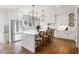 Stylish white kitchen featuring an island, marble countertops, and elegant pendant lighting at 3063 Peachtree Ne Dr, Atlanta, GA 30305