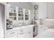 Bright kitchen showcasing a farmhouse sink, stainless steel appliances, and quartz countertops at 3063 Peachtree Ne Dr, Atlanta, GA 30305