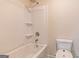 Bathroom featuring a toilet, bathtub and shower head at 412 Barley Lot 86 Ct, Covington, GA 30014