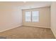 Bedroom featuring two windows, carpet, and neutral walls at 412 Barley Lot 86 Ct, Covington, GA 30014