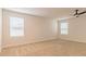 Bright bedroom with neutral walls, carpet, and natural light streaming through horizontal blinds at 412 Barley Lot 86 Ct, Covington, GA 30014