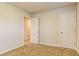 An empty bedroom featuring carpeted floors and access to a private closet at 412 Barley Lot 86 Ct, Covington, GA 30014