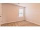 Bright bedroom with a window and carpeted floors at 412 Barley Lot 86 Ct, Covington, GA 30014