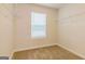 Walk-in closet with neutral walls, carpeted floor, and wire shelving for storage at 412 Barley Lot 86 Ct, Covington, GA 30014