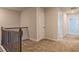 Upstairs hallway featuring wood railing and neutral carpeting at 412 Barley Lot 86 Ct, Covington, GA 30014