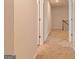 Hallway with carpet and doors leading to other rooms at 412 Barley Lot 86 Ct, Covington, GA 30014