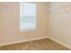 Bright walk-in closet featuring shelving and a window for ample storage and natural light at 412 Barley Lot 86 Ct, Covington, GA 30014