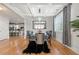 Elegant dining room with coffered ceiling, stylish chairs, and hardwood floors at 310 Nw Brightfield Dr, Loganville, GA 30052