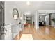 Inviting foyer with gleaming hardwood floors and a stylish console table at 310 Nw Brightfield Dr, Loganville, GA 30052
