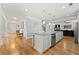 Spacious kitchen with a large island, granite countertops, and stainless steel appliances at 310 Nw Brightfield Dr, Loganville, GA 30052