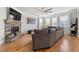 Cozy living room features a stone fireplace, large windows, and comfortable seating for relaxing at 310 Nw Brightfield Dr, Loganville, GA 30052