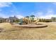 Community playground featuring slides, climbing structures, and ample space for recreational activities at 310 Nw Brightfield Dr, Loganville, GA 30052