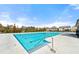 Community pool with marked lanes for swimming and a deck area for relaxing at 310 Nw Brightfield Dr, Loganville, GA 30052