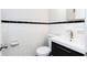 Traditional bathroom with white tile, black accents, and new vanity at 430 Lindbergh Ne Dr # M1, Atlanta, GA 30305