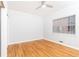 Bright bedroom featuring a ceiling fan, large window, and beautiful hardwood floors at 430 Lindbergh Ne Dr # M1, Atlanta, GA 30305