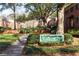 Exterior shot of the brick condominiums community entrance with mature trees and green landscaping at 430 Lindbergh Ne Dr # M1, Atlanta, GA 30305