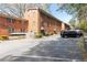 Exterior view of a brick apartment building with ample parking spaces at 430 Lindbergh Ne Dr # M1, Atlanta, GA 30305